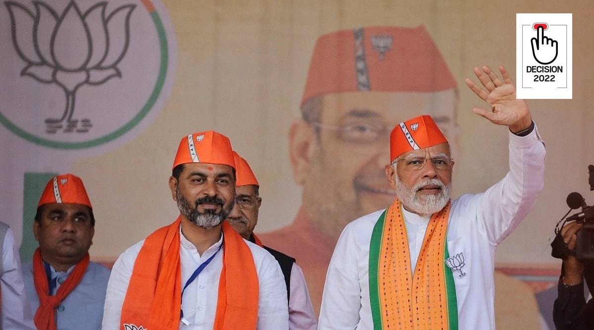 Prime Minister Narendra Modi with Sanjay Mahida, Kheda candidate for Gujarat poll, at a rally in Gujarat's Kheda on Sunday. (Express Photo by Nirmal Harindran)
