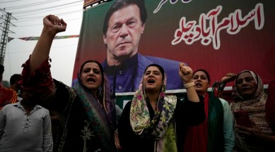 Supporters of former Pakistani Prime Minister Imran Khan's party, 'Pakistan Tehreek-e-Insaf' chant slogans during a protest to condemn a shooting incident on their leader's convoy, in Lahore, Pakistan, Saturday, Nov. 5, 2022. (AP Photo)