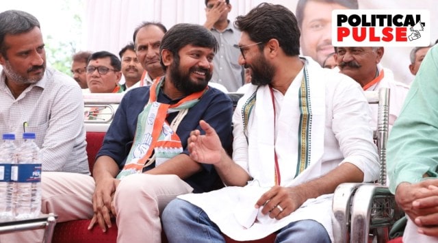 The Congress’s Vadgam candidate Jignesh Mevani (right) chats with party colleague Kanhaiya Kumar on Tuesday. (Express photo)