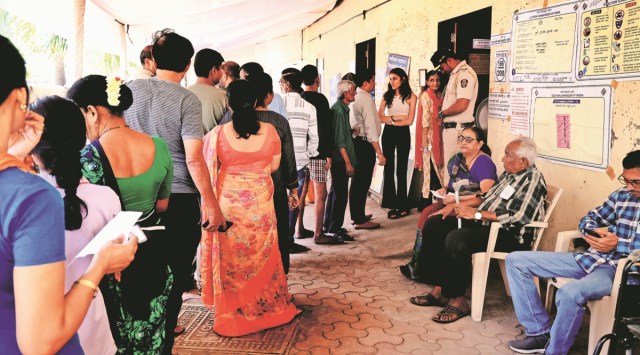 Polling underway at a booth. (Express photo by Amit Chakravarty)

