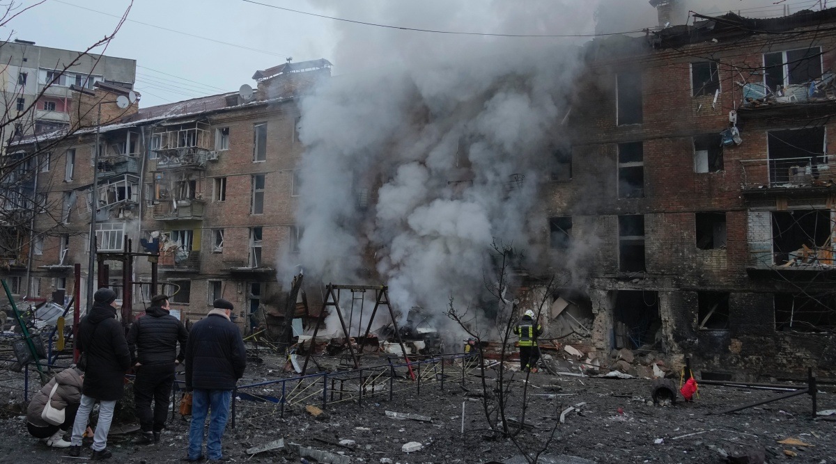 People check a damaged building as emergency personnel work at the scene of a Russian shelling in the town of Vyshgorod outside the capital Kyiv, Ukraine, Wednesday, Nov. 23, 2022. (AP Photo/Efrem Lukatsky)