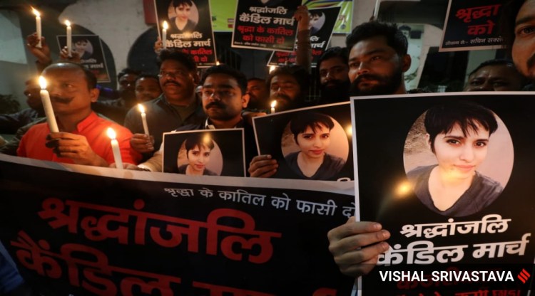 A group holds a candle light vigil in honour of Shraddha Walker in Lucknow on Tuesday.