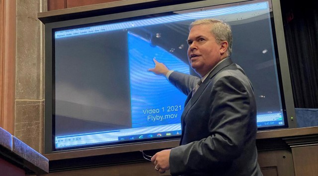 Deputy Director of U.S. Naval Intelligence Scott Bray points to a video of a 'flyby' as he testifies before a House Intelligence Counterterrorism, Counterintelligence, and Counterproliferation Subcommittee hearing about "Unidentified Aerial Phenomena," in the first open congressional hearing on 'UFOs' in more than half-century, on Capitol Hill in Washington, U.S., May 17, 2022. REUTERS/Joey Roulette/File Photo