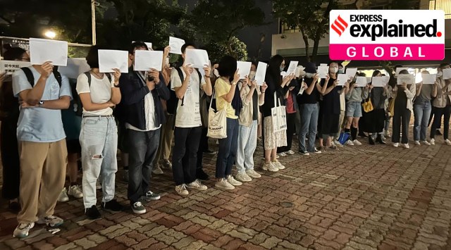 Protesters hold up blank white papers during a commemoration for victims of a recent Urumqi deadly fire at the Chinese University of Hong Kong in Hong Kong, on Monday, November 28, 2022. (AP Photo)