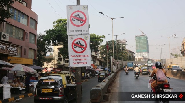 BMC has put up boards advising  two-wheeler riders not to use the bridge.  (Express Photo by Ganesh Shirsekar)