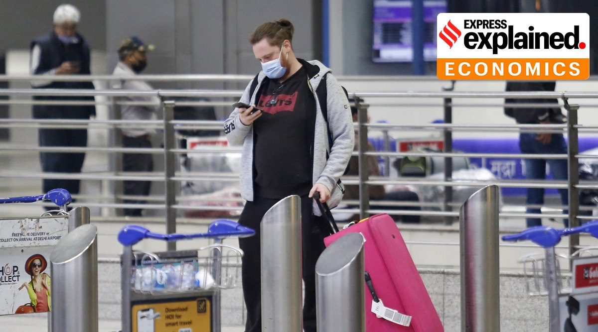 A UK national arrives at Delhi's Indira Gandhi International airport in New Delhi in December 2021. (Express Photo: Praveen Khanna, File) 
