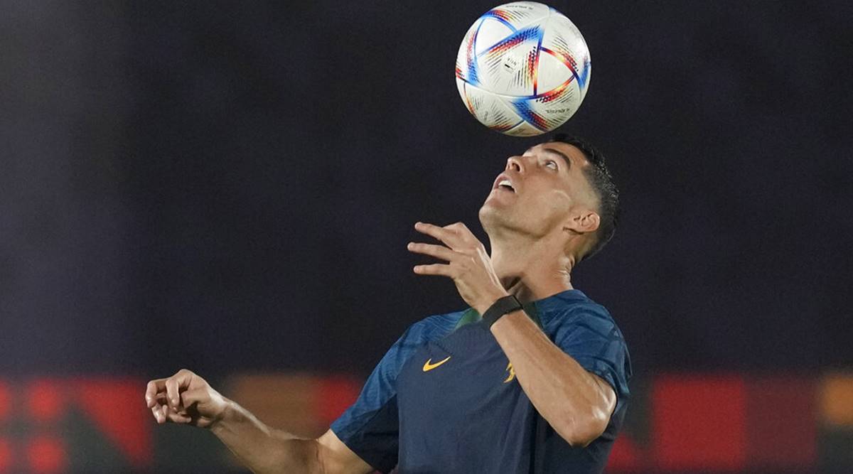 Portugal's Cristiano Ronaldo heads the ball during a team training