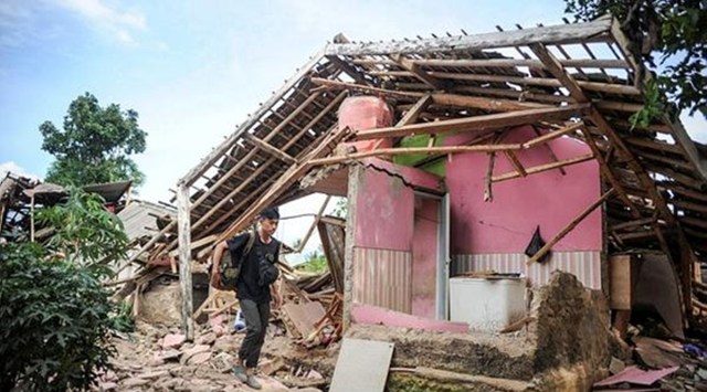 A local walks past a damaged house after an earthquake in Cianjur, West Java province, Indonesia, November 22, 2022. (Via Reuters)