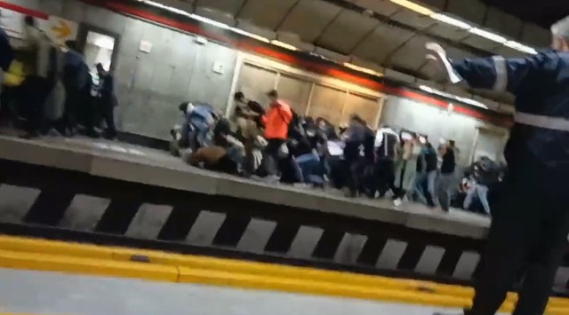 Commuters scramble to escape gunfire at a train station in Tehran. (Screengrab from video shared on social media)