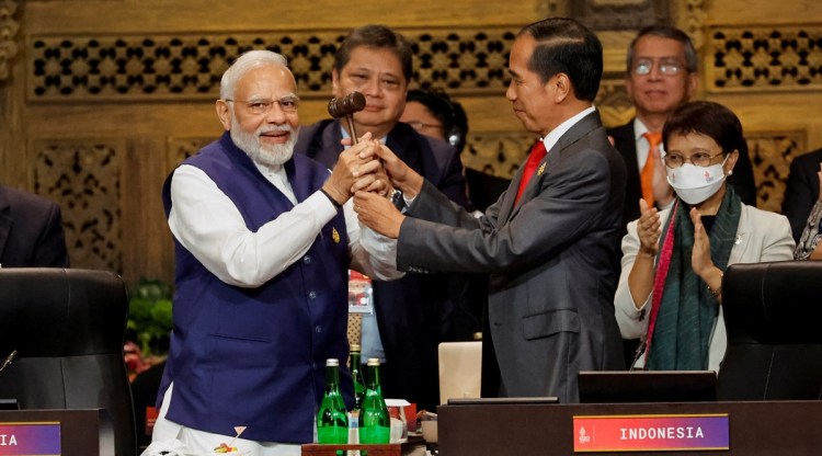 Prime Minister Narendra Modi and Indonesia's President Joko Widodo take part in the handover ceremony at the G20 Leaders' Summit, in Nusa Dua, Bali, Indonesia, Nov. 16, 2022. (Reuters)