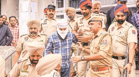 Police take alleged shooter Sandeep Singh to a court in Amritsar on Saturday. PTI