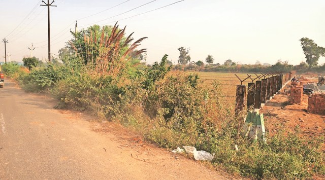 The spot where a woman’s body was found bundled in a red suitcase near the Yamuna Expressway in Mathura, Uttar Pradesh, on Friday. (Express Photo by Amit Mehra)