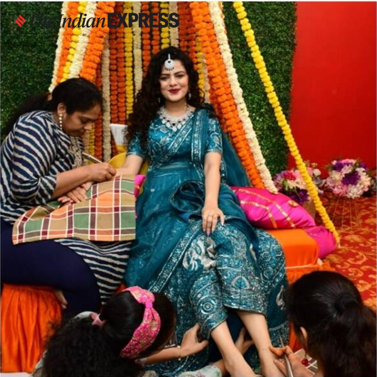 El cantante Palak Muchhal deslumbra con un decorado lehenga rojo para la boda con Mithoon Sharma