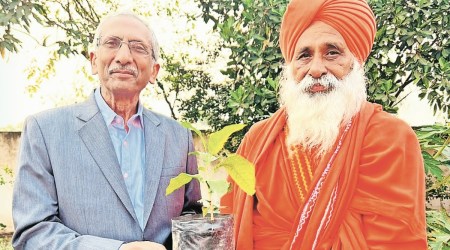 NGT chairperson Justice A K Goel (L) with AAP Rajya Sabha member Baba Balbir Singh Seechewal (R) on Sunday. (Express Photo)
