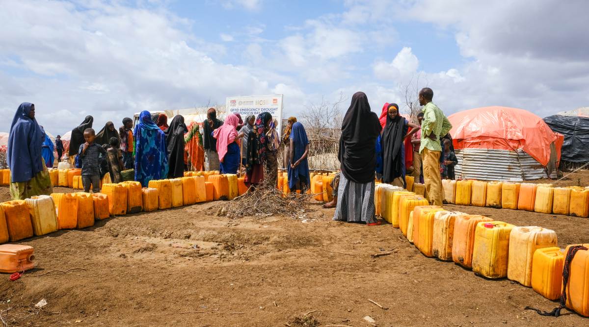 Somalis displaced by drought wait in line to fill jerrycans with water distributed by the Norwegian Refugee Council, on the outskirts of Baidoa, in Somalia Saturday, Oct. 29, 2022. 
(AP Photo)