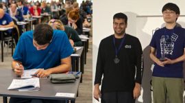 world puzzle championship silver medalist prasanna seshadri beside gold medalist ken endo on podium
