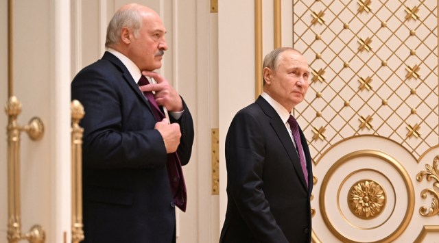 Russian President Vladimir Putin and Belarusian President Alexander Lukashenko arrive for a news conference following their meeting in Minsk, Belarus December 19, 2022. Sputnik, Kremlin via Reuters)