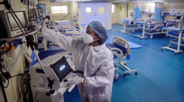 A medical staffer at Thane Municipal Corporation’s Covid Centre checks equipment as part of preparations to handle Covid cases, on Thursday. (PTI)