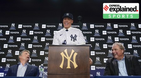New York Yankees' Aaron Judge, center, speaks while owner Hal Steinbrenner, left, and president Randy Levine look on during a baseball news conference at Yankee Stadium, Wednesday, Dec. 21, 2022, in New York. Judge has been appointed captain of the New York Yankees after agreeing to a $360 million, nine-year contract to remain in pinstripes. (AP Photo)