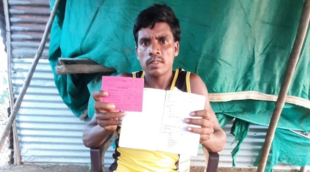 Burshalal Vasane shows his sickle cell card. (Express Photo)