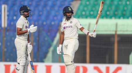 India's Cheteshwar Pujara celebrates fifty runs with Shreyas Iyer. (AP) 