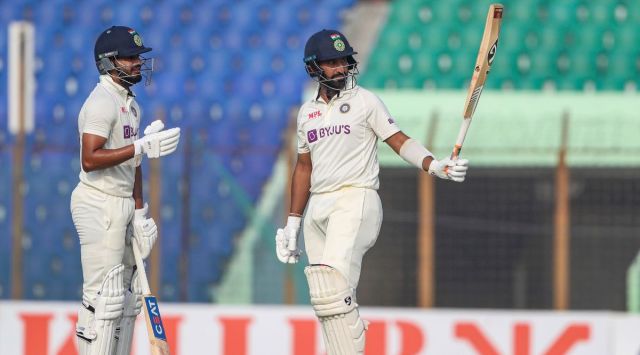 India's Cheteshwar Pujara celebrates fifty runs with Shreyas Iyer. (AP) 