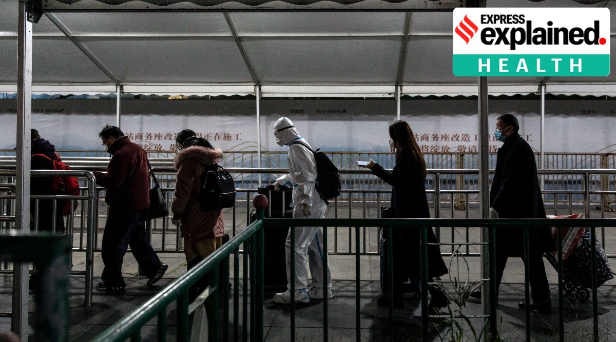  Passengers, including one wearing full-bodied protective gear, at the Shanghai Railway Station in China on Dec. 14, 2022. In the absence of credible information from the Chinese government, researchers around the world are looking for any clues to determine the size and severity of the COVID-19 surge. (File/Qilai Shen/The New York Times)
