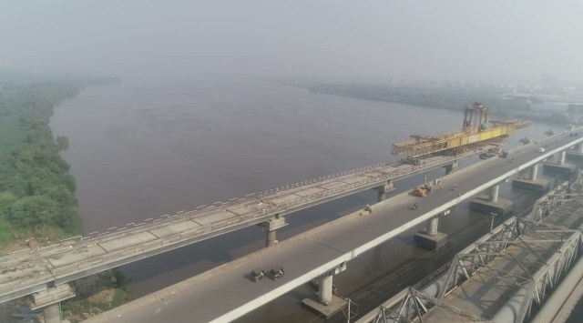 Of the 12.7-km stretch, a 550-m area passes through the Kasheli creek. Officials said that 50 per cent of the work above the water body has been completed. (Courtesy: MMRDA)