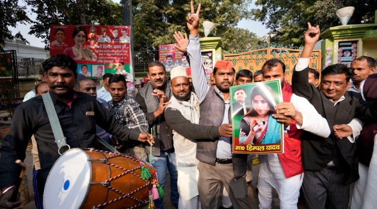 Samajwadi Party workers celebrate Dimple Yadav's win in Mainpuri by-election, at party office in Lucknow. (PTI Photo)
