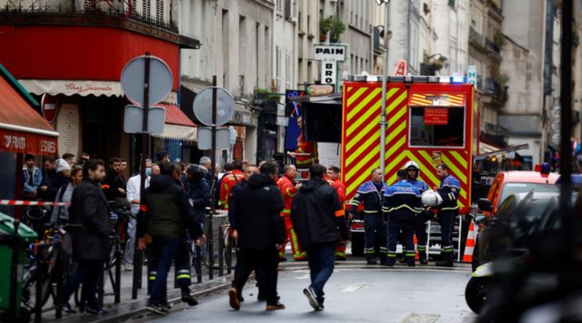 French police and firefighters secure a street after gunshots were fired killing two people and injuring several in a central district of Paris, France, December 23, 2022. (REUTERS/Sarah Meyssonnier)
