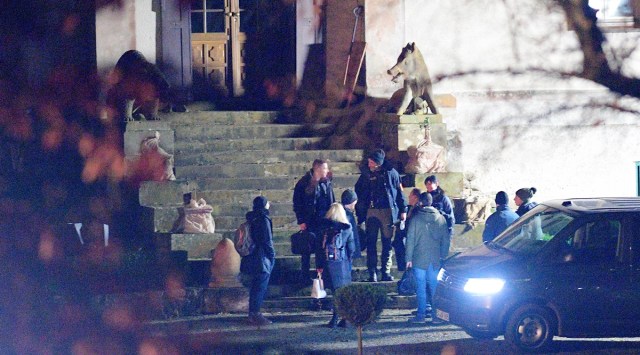Officials leave the hunting lodge Waidmannsheil after twenty-five suspected members and supporters of a far-right group were detained during raids across Germany, in Bad Lobenstein-Saaldorf, Dec. 7, 2022. (Reuters)