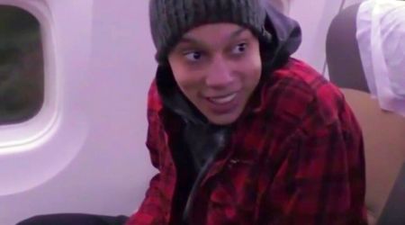 In this image made from video provided by Russian Federal Security Service, WNBA star and two-time Olympic gold medalist Brittney Griner sits in the plane as she flies to Abu Dhabi to be exchanged for Russian citizen Viktor Bout, in Russia, Friday, Dec. 9, 2022. (Russian Federal Security Service via AP)