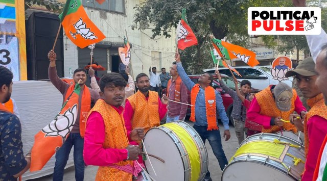 BJP workers celebrate in Ahmedabad as the Gujarat Assembly election results are declared on December 8, 2022. (Express Photo: Nirmal Harindran)
