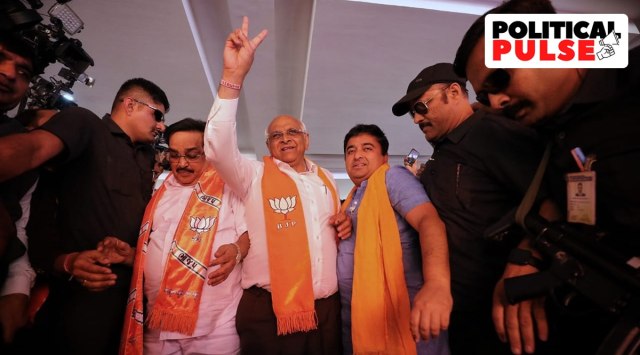 Gujarat Chief Minister Bhupendra Patel along with BJP state president C R Paatil arrive at the party headquarters in Gandhinagar on Thursday. (Express Photo: Nirmal Harindran)