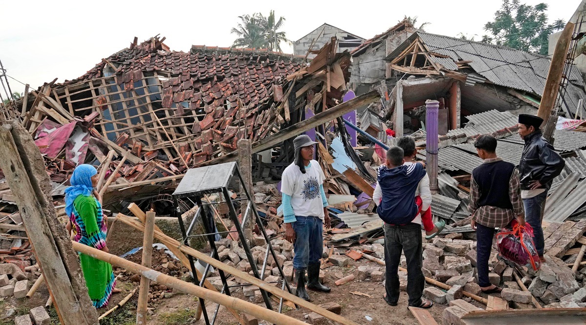 People inspect the ruins of their houses badly damaged in Monday's earthquake in Cianjur, West Java, Indonesia Tuesday, Nov. 22, 2022. The earthquake has toppled buildings on Indonesia's densely populated main island, killing a number of people and injuring hundreds. (AP/PTI)