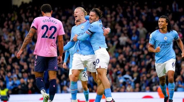 Manchester City's Erling Haaland, centre, celebrates after scoring the opening goal during the English Premier League soccer match between Manchester City and Everton at the Etihad Stadium in Manchester, England, Saturday, Dec. 31, 2022. (Tim Goode/PA via AP)