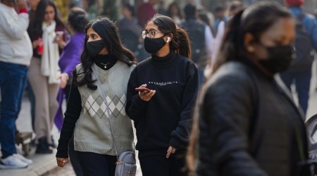 People wearing masks in a market on Thursday, Dec 22, 2022 (Representational/PTI photo)