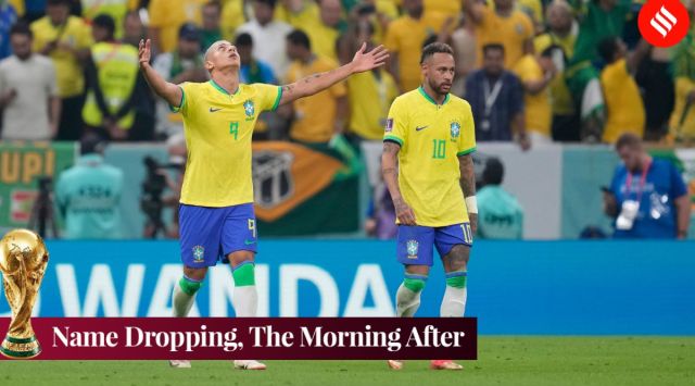 Brazil's Richarlison, left, celebrates after scoring his side's opening goal as Brazil's Neymar looks on during the World Cup group G soccer match between Brazil and Serbia, at the Lusail Stadium in Lusail, Qatar. (AP)