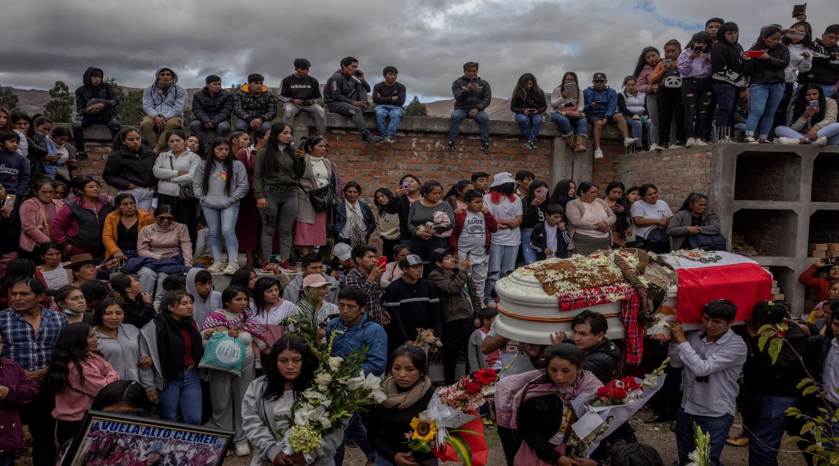 Mourners attend the funeral of Clemer Fabricio Rojas, who died during a protest at the airport in Ayacucho on Thursday, in Quinua, Peru, on Saturday, Dec. 17, 2022. (Victor Moriyama/The New York Times)