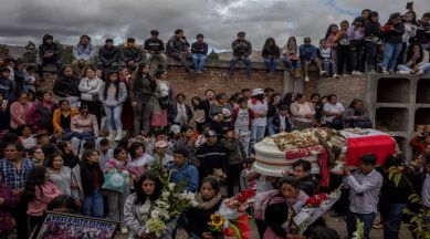 Mourners attend the funeral of Clemer Fabricio Rojas, who died during a protest at the airport in Ayacucho on Thursday, in Quinua, Peru, on Saturday, Dec. 17, 2022. (Victor Moriyama/The New York Times)