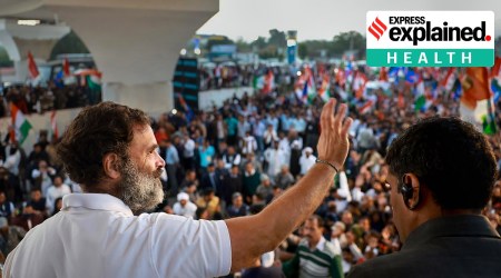 Congress leader Rahul Gandhi waves at a crowd of supporters during the Bharat Jodo Yatra