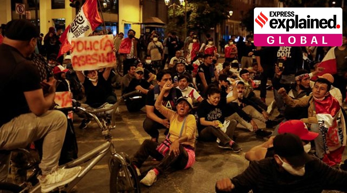 Protestors sitting and raising slogans and placards in Peru.