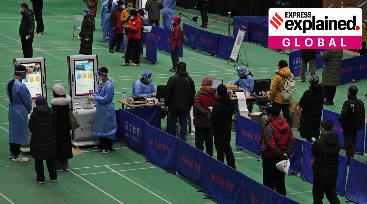 Medical workers attend to visitors at a fever clinic converted from a gymnasium in Beijing.