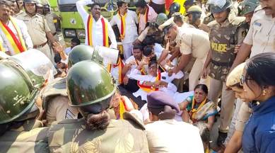 Police detain Karnataka Rakshana Vedike supporters at Hirebagewadi in Belagavi on Tuesday. (Photo: ANI)