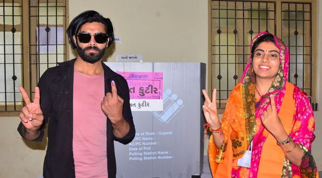 Cricketer Ravindra Jadeja with his wife and BJP candidate Rivaba Jadeja after casting his vote during the first phase of Gujarat Assembly elections, in Jamnagar, Thursday, Dec. 1, 2022. (PTI Photo)