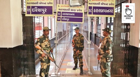 Security personnel outside an EVM strong room in Ahmedabad on Tuesday. (Express photyo by Nirmal Harindran)