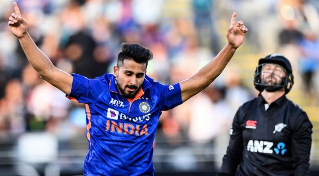 India's Umran Malik celebrates taking the wicket of New Zealand's Devon Conway during their one day international cricket match in Auckland, New Zealand. (AP)
