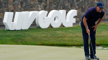 FILE - Phil Mickelson lines up a shot on the 18th hole during the first round of the Bedminster Invitational LIV Golf tournament in Bedminster, N.J., July 29, 2022. Players who defected from the PGA Tour to join Saudi-funded LIV Golf are still welcome at the Masters next year, even as Augusta National officials expressed disappointment Tuesday, Dec. 20, in the division it has caused in golf. (AP Photo/Seth Wenig, File)
