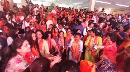 BJP workers wearing orange caps and scarves thronged the party office. Party members were seen dancing to various party songs centred around Prime Minister Narendra Modi, and also chanting 'Modi, Modi' and 'Bharat Mata ki jai. A band of guitarists also performed at the party office. (Express photo by Nirmal Harindran)