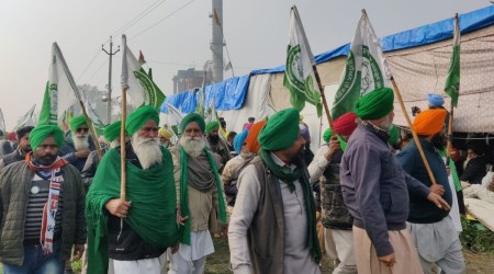A group of farmers  move towards Zira dharna site. (Express Photo)